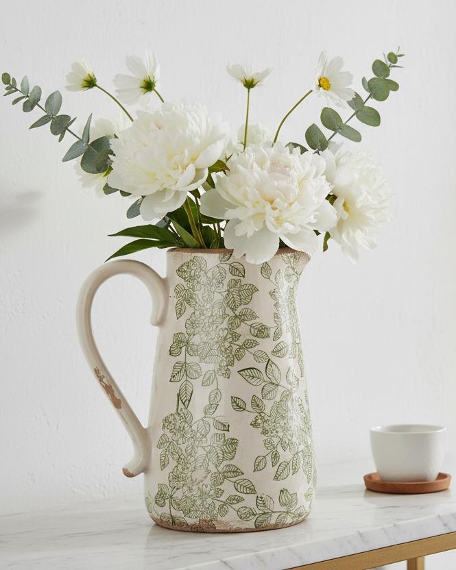 Green and white ceramic flowers jug by Clayre & Eef featuring a decorative floral design and a classic ceramic finish.