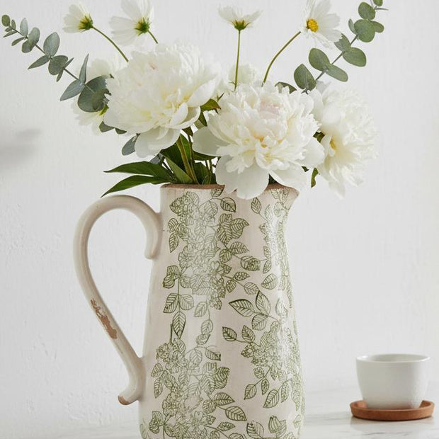 Green and white ceramic flowers jug by Clayre & Eef featuring a decorative floral design and a classic ceramic finish.