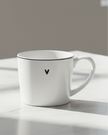 White ceramic mug featuring a black heart design from Clayre & Eef, perfect for kitchen and dining use.
