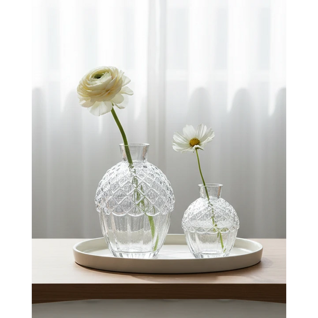Set of two clear glass acorn vases by Wikholmform, perfect for Christmas decor, with intricate acorn shape and transparency.