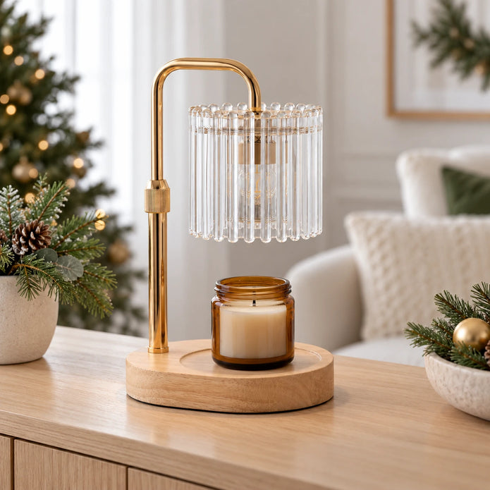 Clear ribbed glass candle warmer lamp with gold-tone arm and wooden base, styled with an unlit candle on an oak console