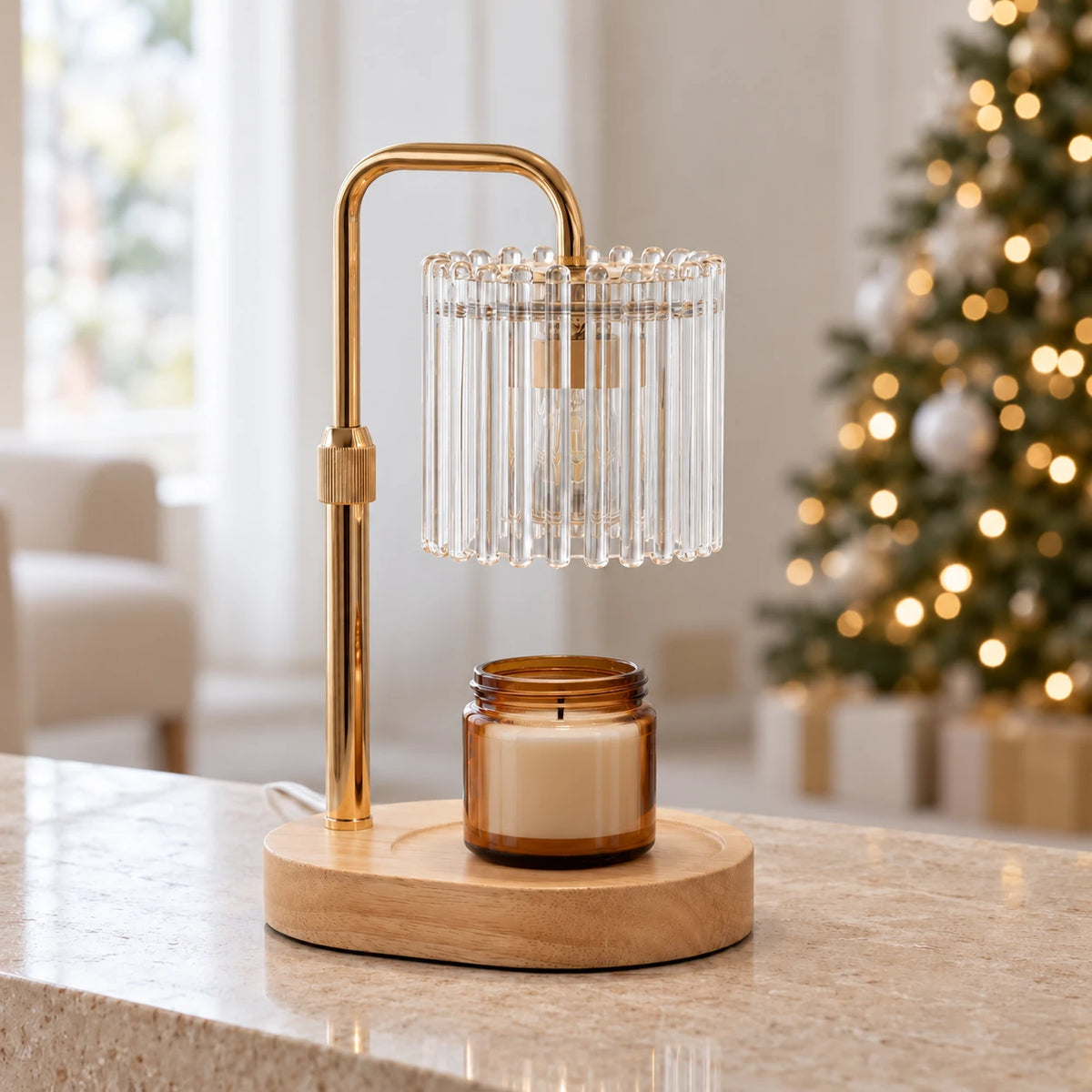 Clear glass candle warmer lamp with an unlit amber jar candle in a neutral Christmas living room