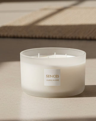 White Alang Alang 4-wick lidded candle by Coach House, featuring a sleek white ceramic container with a removable lid.