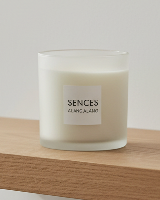 White Alang Alang large 3-wick candle by Coach House with tonka and clove scent, shown in a simple white candle holder.