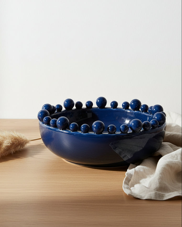 Extra large navy blue bowl with a bobble-edged design, perfect for home decor by Coach House.