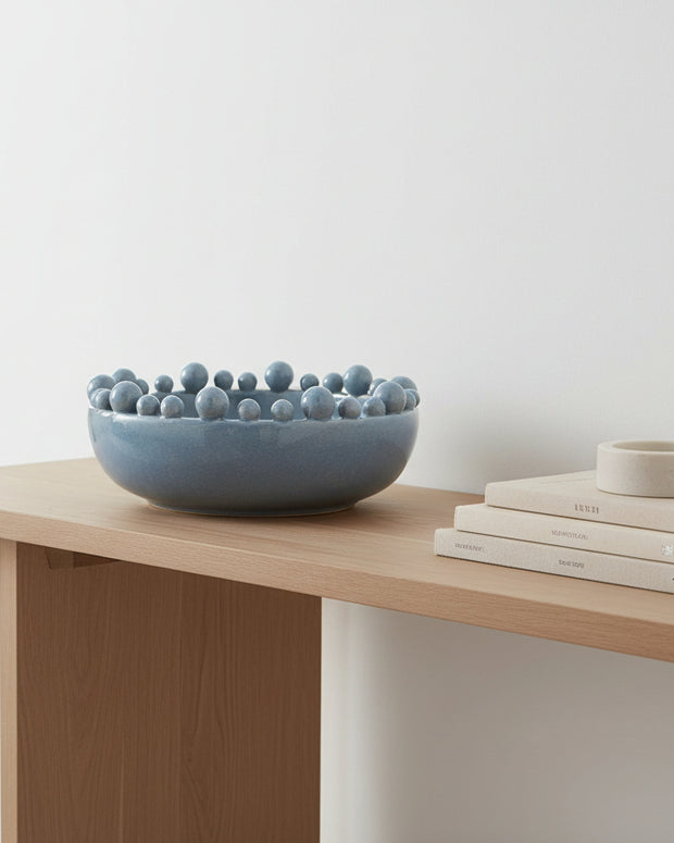 Extra large ocean blue bobble-edged bowl from Coach House home decor, showcasing its textured rim and vibrant color.