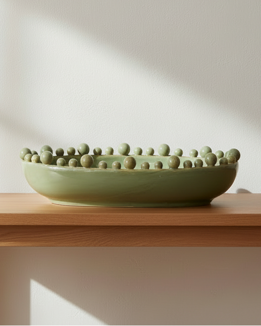 Oval extra large sage green Coach House bowl with bobble-edged design, perfect for home decor display.