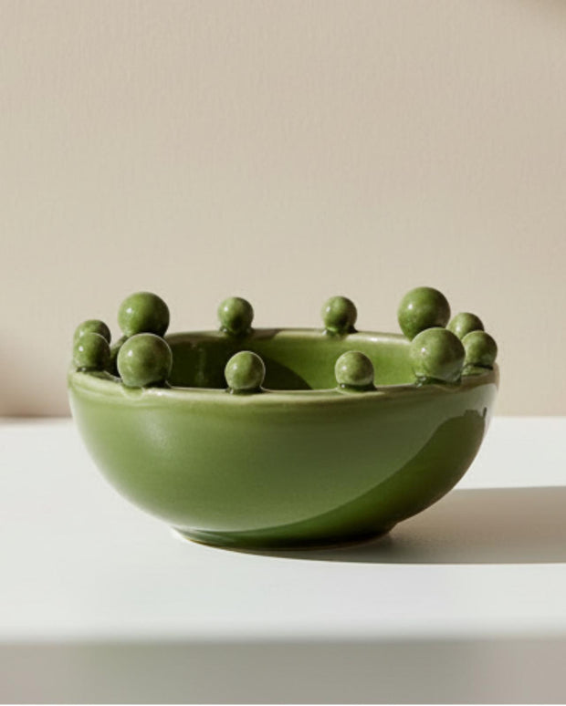 Small olive green Coach House bobble-edged bowl, a decorative home decor piece with textured edges, ideal for display or use.