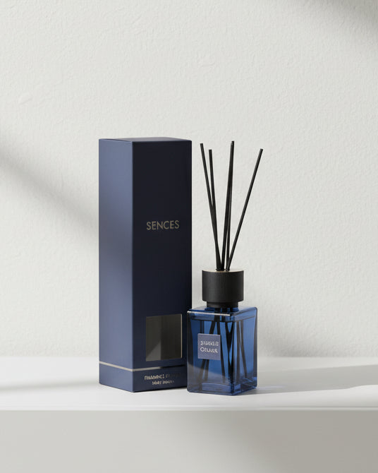 Navy blue Ocean small reed diffuser by Coach House, coastal home fragrance with reed sticks and decorative bottle.