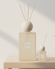White Petra XL Reed Diffuser from Coach House with travertine top and pink pepper scent, designed for home fragrance.