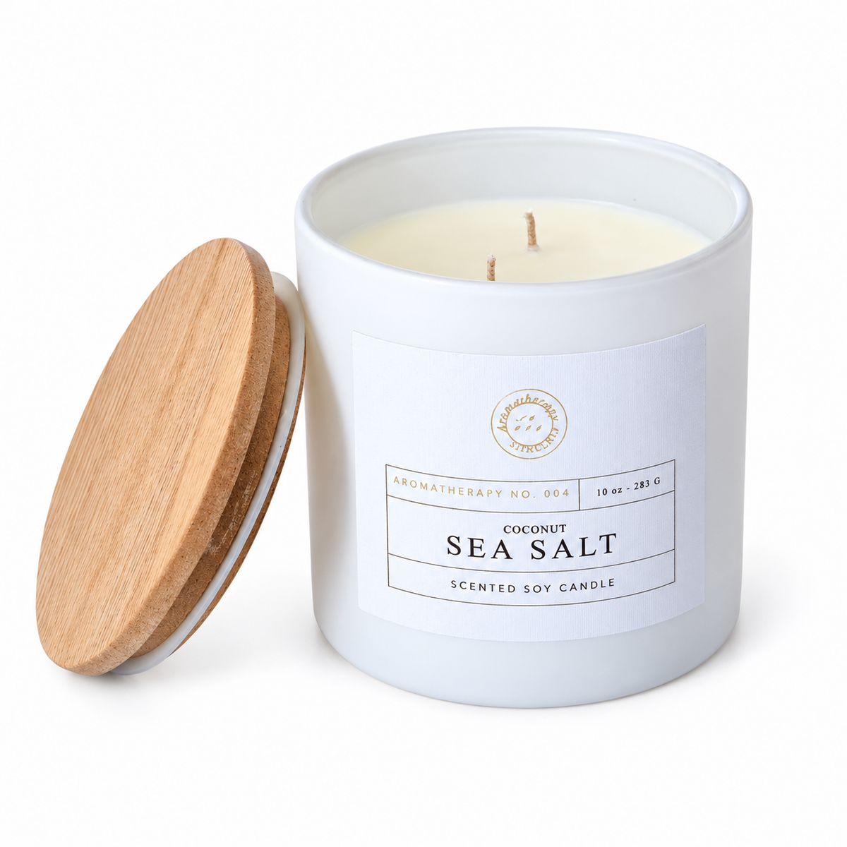 Closer view of the Coconut and Sea Salt candle label, two unlit wicks and wooden lid.