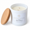Coconut and Sea Salt candle, unlit white jar with two wicks and wooden lid on white.