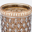 Close-up of the distressed metal rim and silver-white diamond texture on the cognac glass tea light holder.
