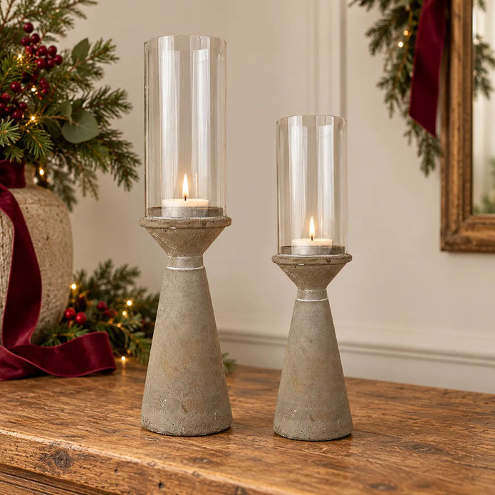 Small and Medium concrete hurricane candle holders styled on an oak Christmas console