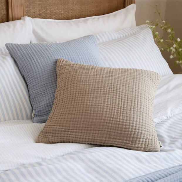 Ocean blue muslin cotton cushion cover by Riva Home, soft furnishings with a smooth, lightweight fabric and subtle texture.
