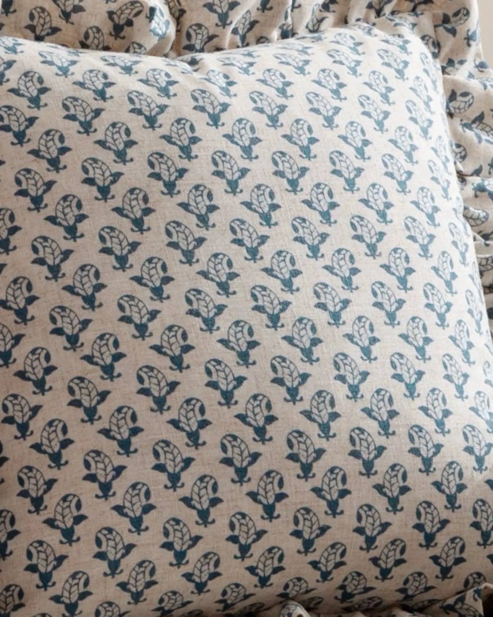 Blue Lulah block printed ruffle cushion cover from Riva Home, soft furnishings with textured ruffle detail and vibrant pattern.
