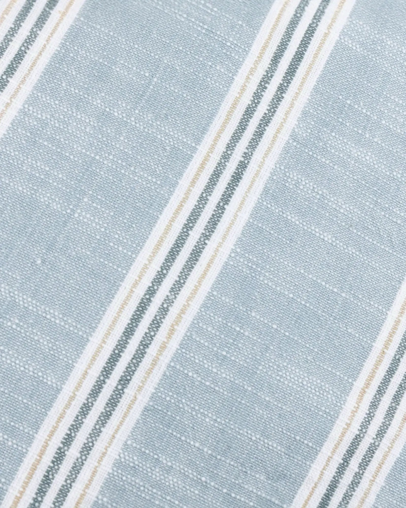 Ocean blue and white striped cotton cushion cover by Riva Home, featuring a soft, stylish design for home decor.