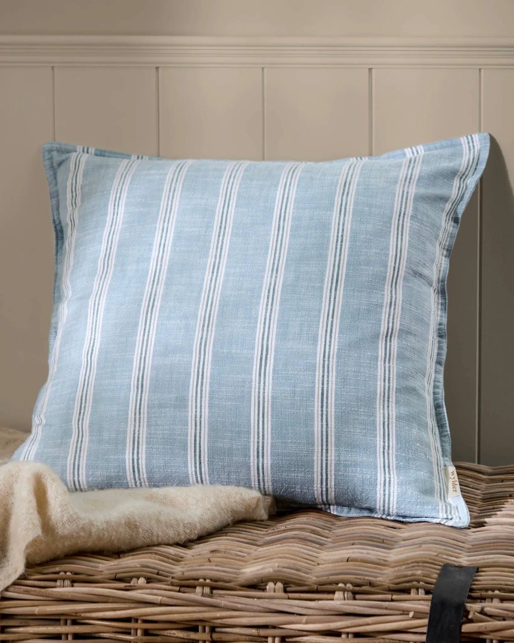 Ocean blue Abersoch Stripe cotton cushion cover from Riva Home showing soft furnishings with blue and white striped pattern