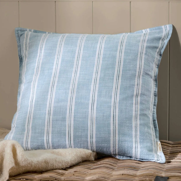 Ocean blue Abersoch Stripe cotton cushion cover from Riva Home showing soft furnishings with blue and white striped pattern
