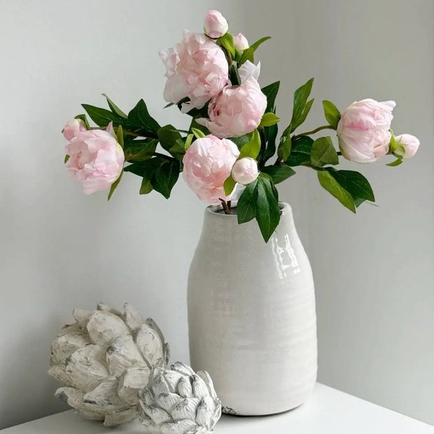 Artificial pale pink double peony flower stem from Starlight Express, showcasing lush, realistic blooms on a slender stem.