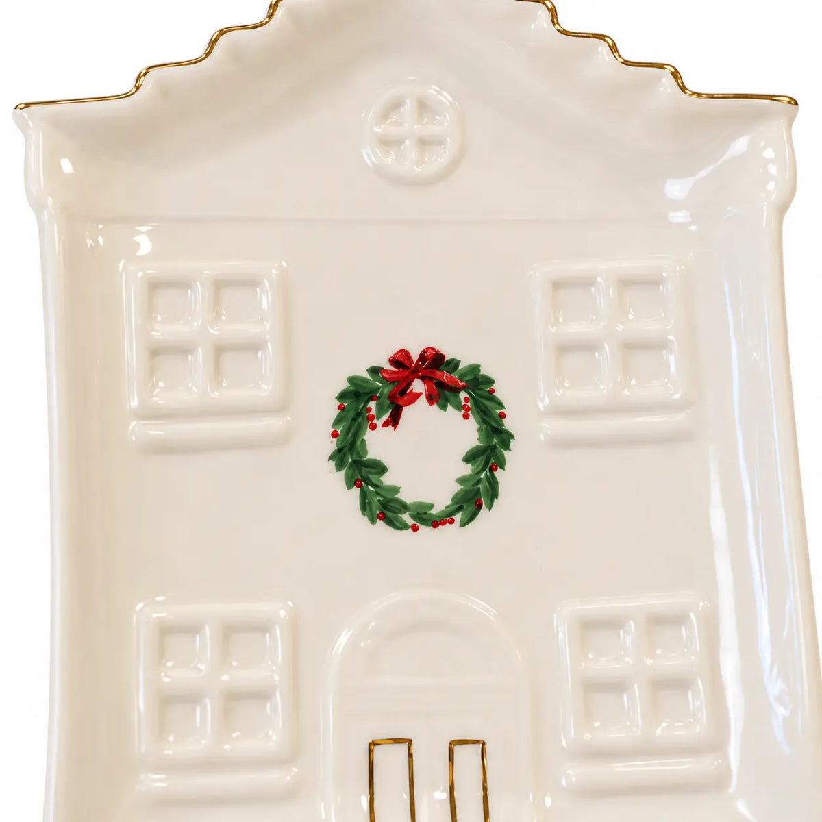 Close-up of the painted wreath, embossed windows and gold details on the Cosy Christmas House Plate.
