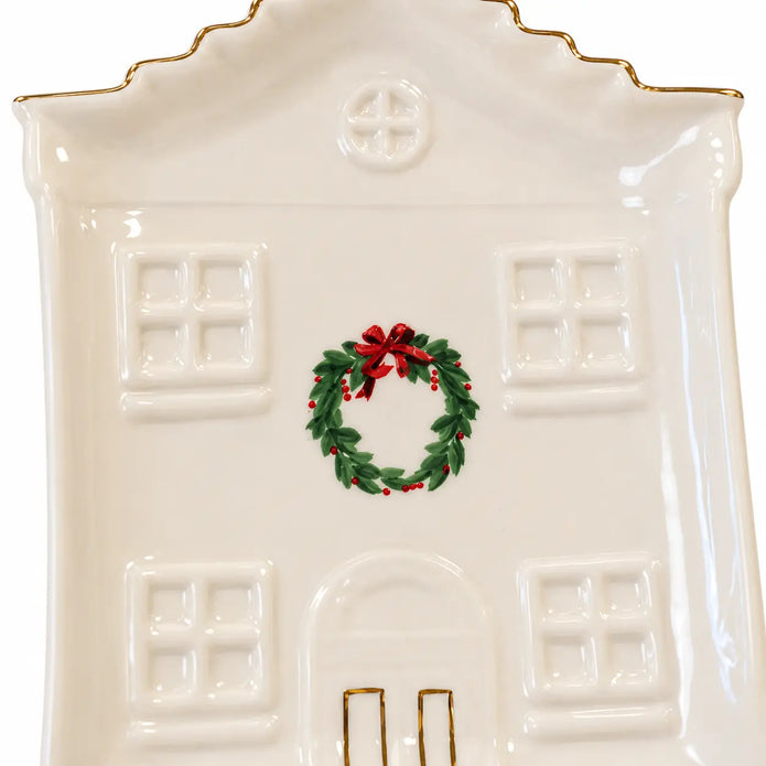 Close-up of the painted wreath, embossed windows and gold details on the Cosy Christmas House Plate.