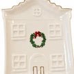 Close-up of the painted wreath, embossed windows and gold details on the Cosy Christmas House Plate.