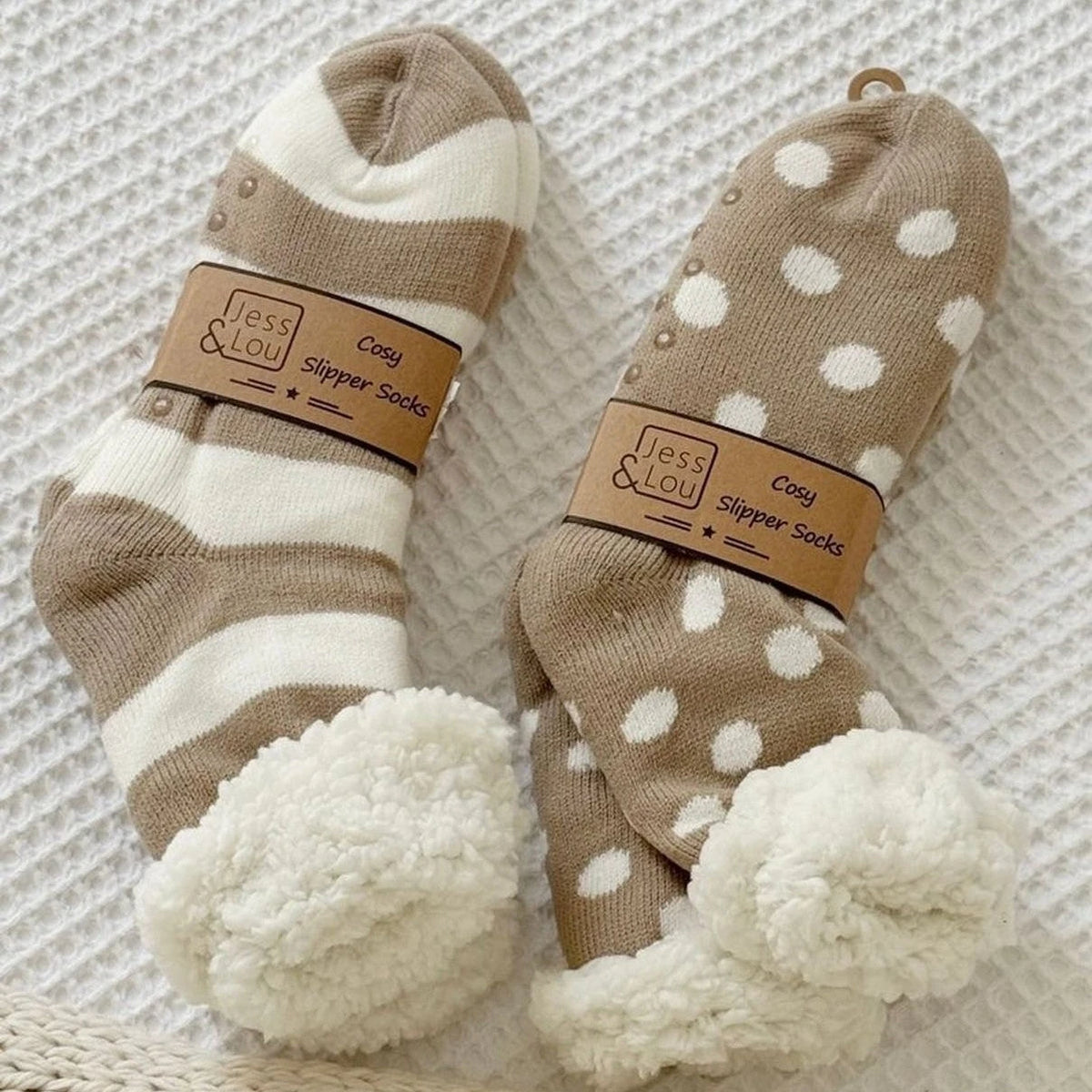 Beige polka dot cozy slipper socks from Jess & Lou, soft and warm accessories for comfortable indoor wear.