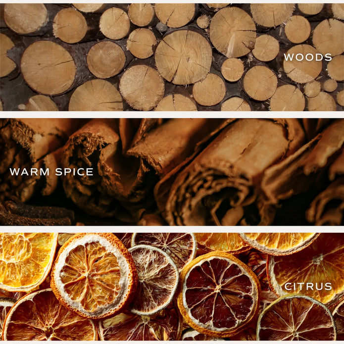 Cozy Season candle fragrance graphic showing stacked logs, cinnamon sticks and dried citrus slices.