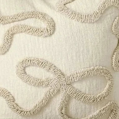 Cream and beige bow square boucle cushion cover by Starlight Express, soft furnishings with a textured boucle fabric and decorative bow detail.