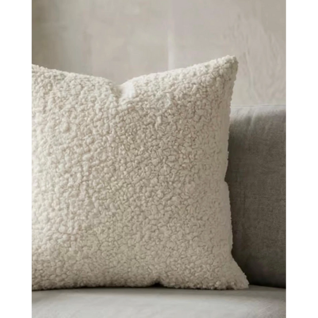 Cream boucle cushion cover from Starlight Express, soft furnishings with textured fabric and cozy appearance.