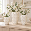 Small, medium and large ivory cream ceramic bobble vases with white flowers, shown together for size comparison; each sold separately