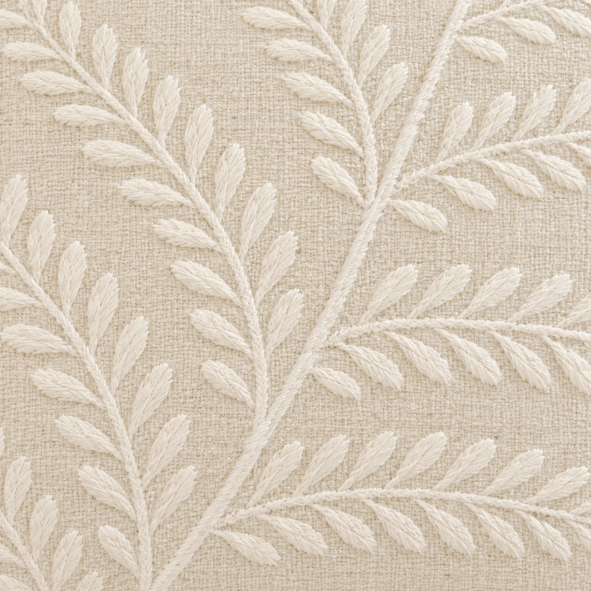 Cream Fern Embroidered Cushion Cover, close-up of raised cream leaves and stems on the woven fabric.