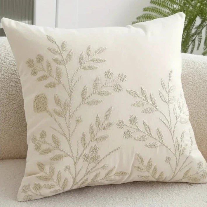 Cream floral embroidered cushion cover by Starlight Express, soft furnishings with intricate flower embroidery and plush fabric.
