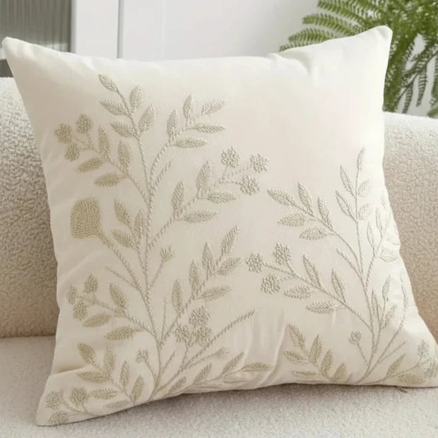 Cream floral embroidered cushion cover by Starlight Express, soft furnishings with intricate flower embroidery and plush fabric.