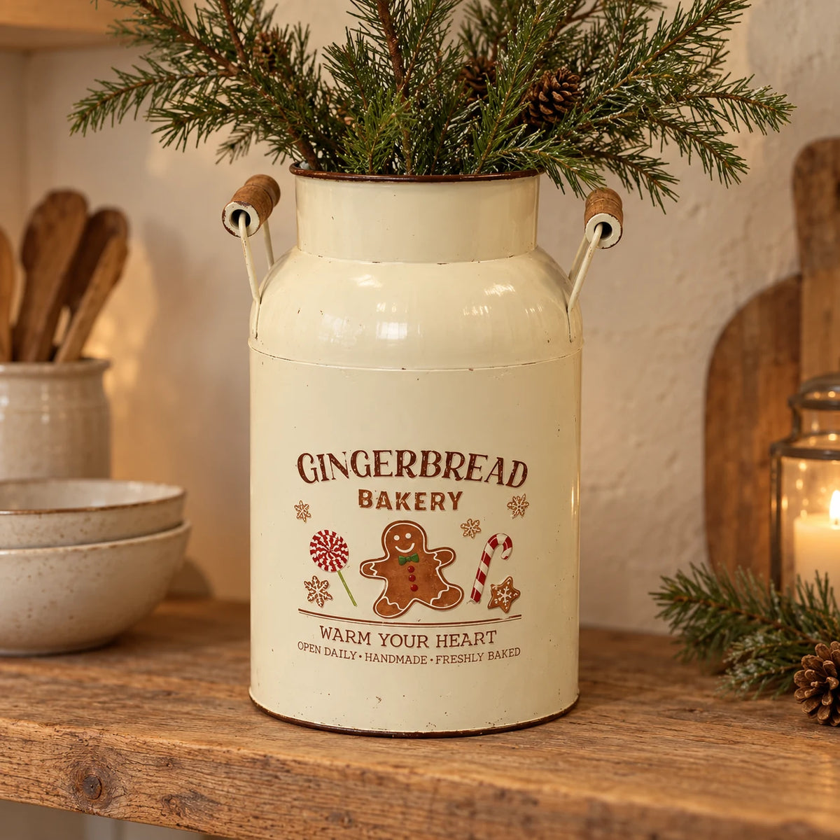 Cream Gingerbread Bakery urn holding pine stems on a rustic oak kitchen shelf