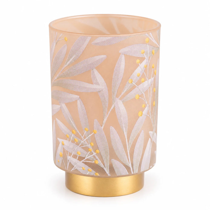 Cream and gold LED glass lantern used as elegant home decor, illuminated with a warm light in a white studio setting.