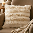 Cream luxury faux fur cushion by Malini, showcasing soft, plush fabric for cozy home décor.