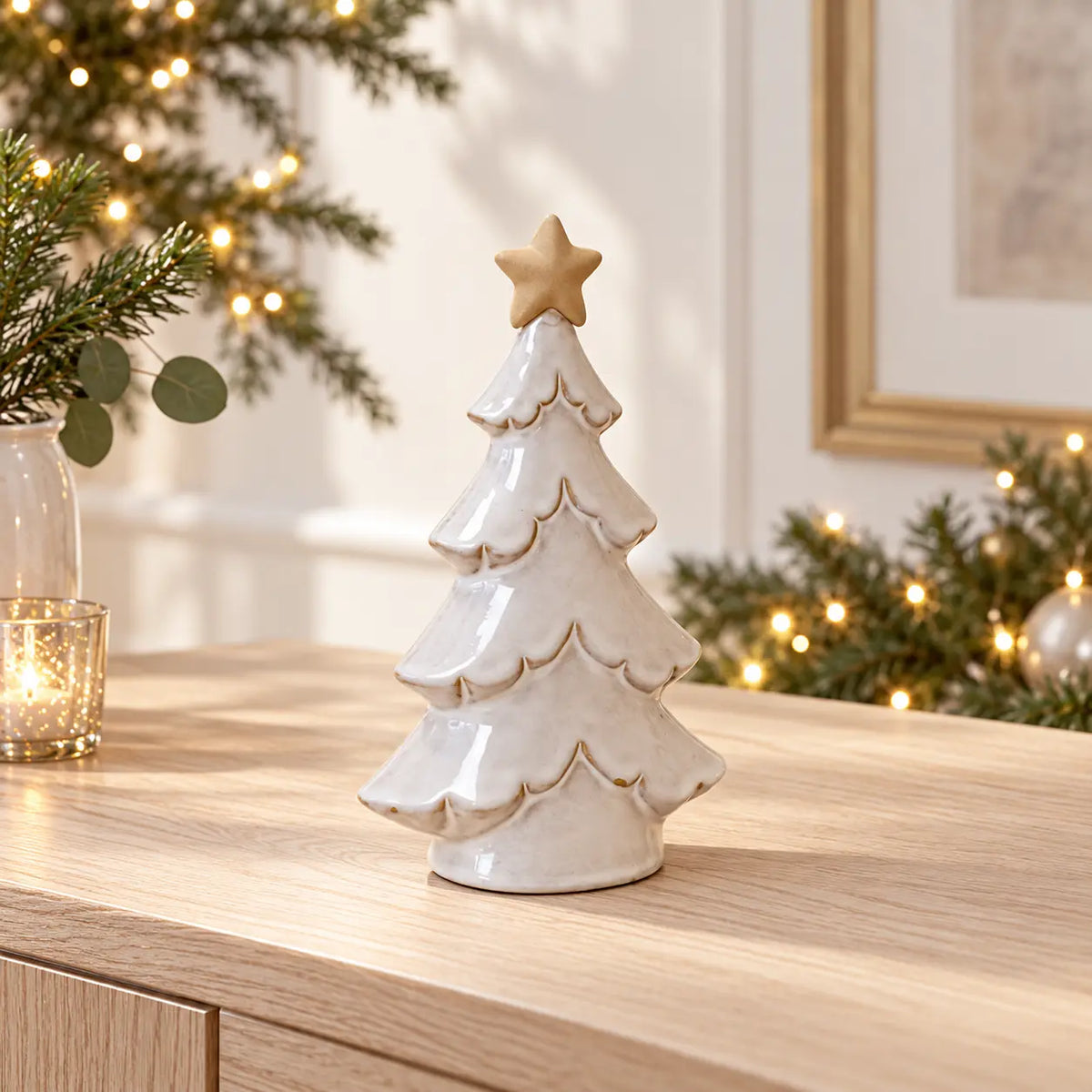 Satchville medium glazed ceramic Christmas tree with cream star topper on console table