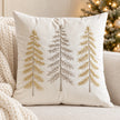 Cream velvet cushion cover with gold and silver embroidered Christmas trees styled on an ivory sofa
