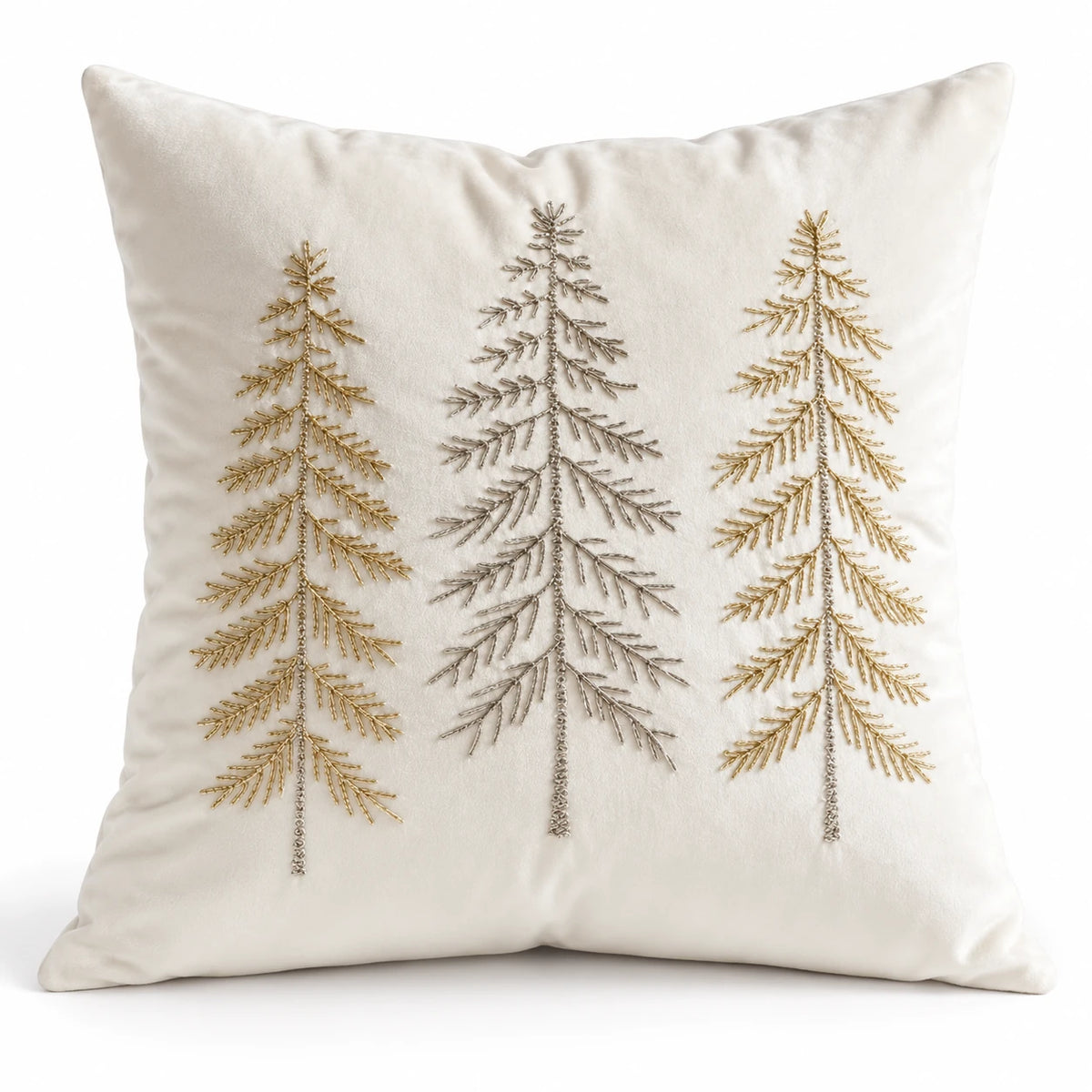 Studio view of cream velvet Christmas cushion cover showing gold and silver tree embroidery