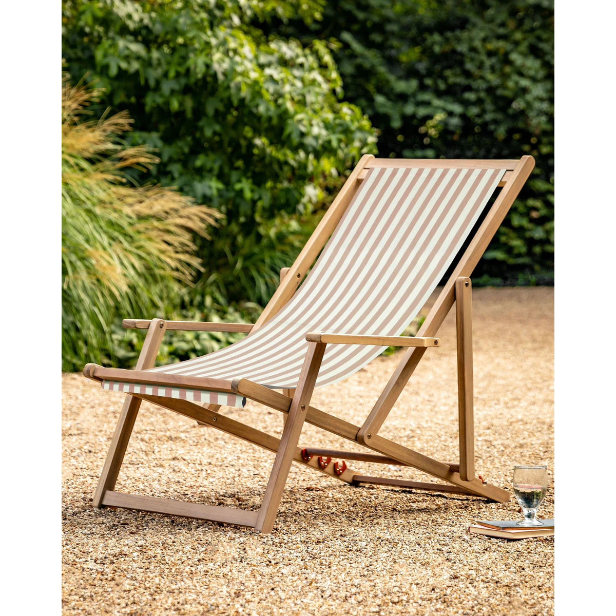 Creta wooden striped beige garden chair by Gallery Direct, showcasing its woven wooden design and comfortable outdoor seating