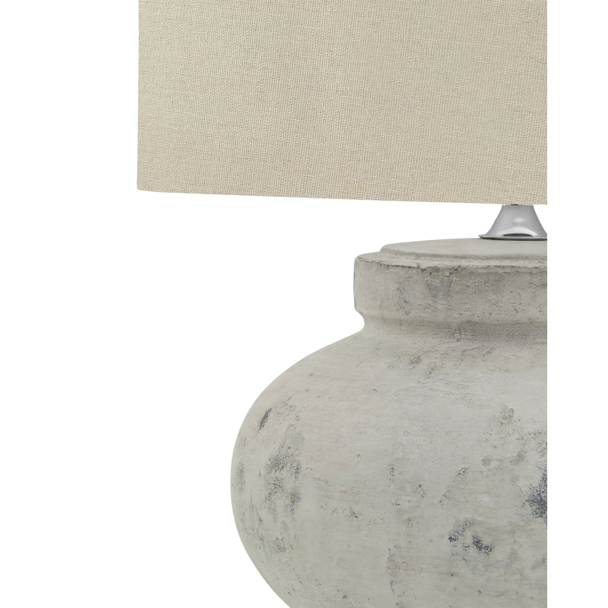 Round stone lamp with squat design by Hill Interiors, featuring a textured surface and modern lighting aesthetic.
