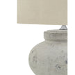Round stone lamp with squat design by Hill Interiors, featuring a textured surface and modern lighting aesthetic.