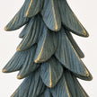 Close-up of textured dark sage resin branches with distressed gold edging against white.