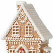 Close-up of the gingerbread house roof, white icing heart and upper windows