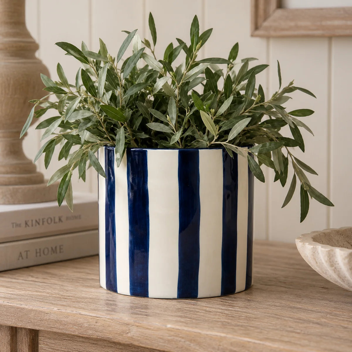 Deep blue and white striped ceramic planter pot by Satchville, round shape with a glossy finish, ideal for indoor plants.