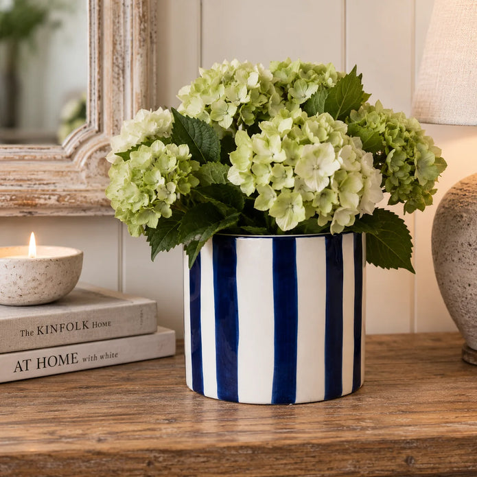 Deep blue and white striped ceramic planter pot by Satchville, round vase with bold horizontal stripes for home decor.