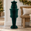 One-metre deep green paper nutcracker beside an oak bench for scale