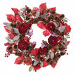 Deep red foliage and pumpkin Christmas wreath by Heaven Sends, featuring festive fall-inspired decorations and rich seasonal colors.